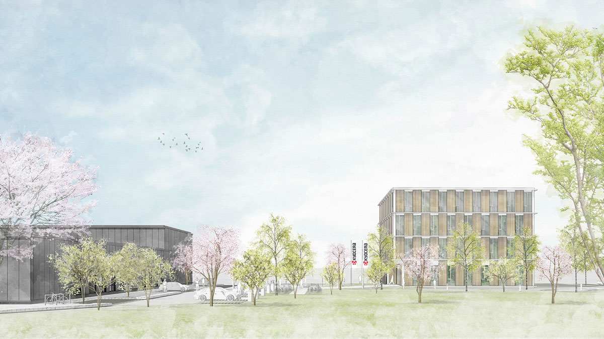 A modern campus with 2 buildings, several flowering trees, a few cars and a slightly cloudy sky