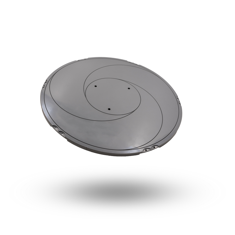 Ein runder Waferchuck in tellerform mit symmetrischen Design und vier kleinen Löchern in der Mitte.